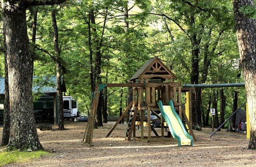 Branson Cabin | Rustic Camper Retreat with Fire Pit & Rocking Chairs in Branson, Missouri