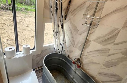 Bitely House | Rustic Converted School Bus with Outdoor Shower Near ORV Trails in Manistee National Forest, Michigan