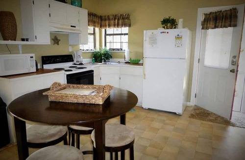 Townsend House | Rustic Creekside Cabin Rental with a Private Dock near the Georgia Coast