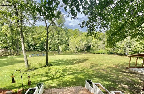 Paris House | Rustic large luxury home with 300 feet of riverfront surrounded by woods.