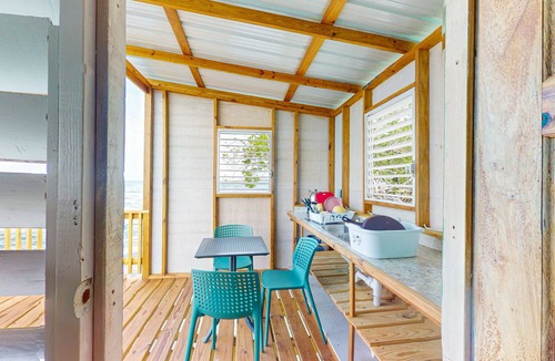 Sittee Point Apartment | Rustic oceanfront cabin w/overwater kitchenette, sea views & private deck
