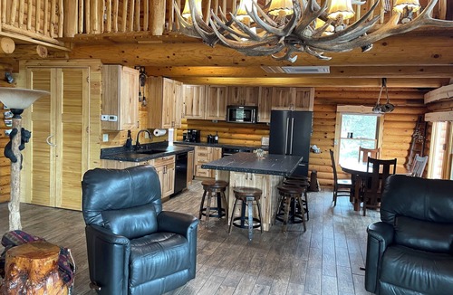 Rapid City House | Rustic, yet comfortable log home with hot tub, sauna, and wood-fired pizza oven.