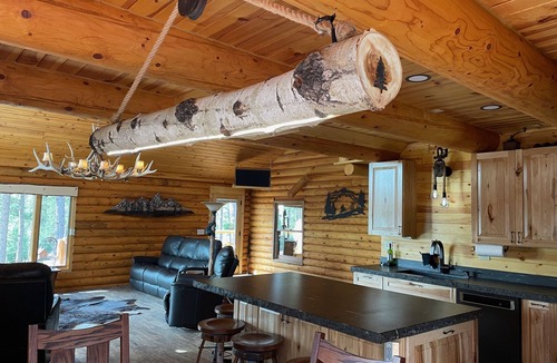 Rapid City House | Rustic, yet comfortable log home with hot tub, sauna, and wood-fired pizza oven.