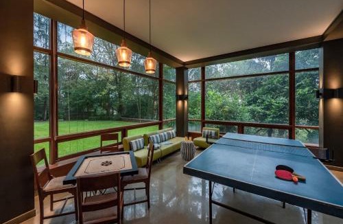 St.Stanislaus Villa Villa | SaffronStays Odeon - 4BR heritage art deco villa with cantilever pool, verandahs & forested lawns