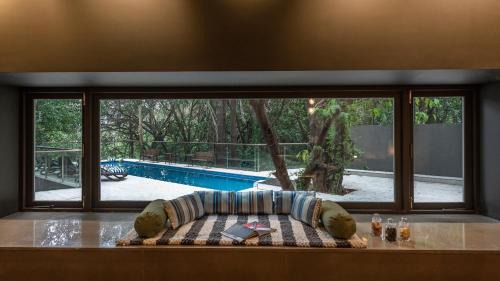 St.Stanislaus Villa Villa | SaffronStays Odeon - 4BR heritage art deco villa with cantilever pool, verandahs & forested lawns