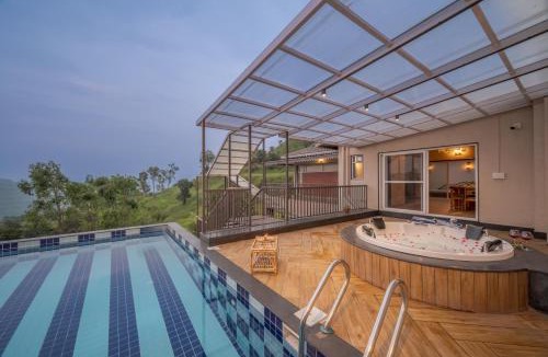 Mahabaleshwar Villa | SaffronStays Skyfall - 4BR boho-chic villa with pool, jacuzzi, game room & stunning hill views near Table Land, Panchgani