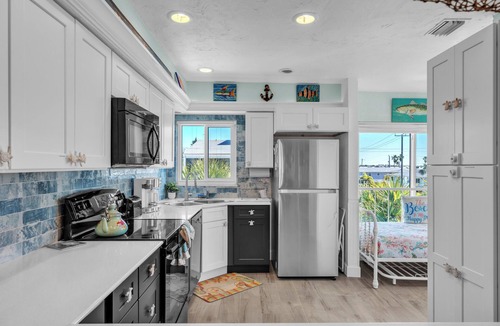 Holmes Beach Condo | Sandy Cheeks & Barefeet, Gorgeous interior Gulf beach Place, pool, on beach side