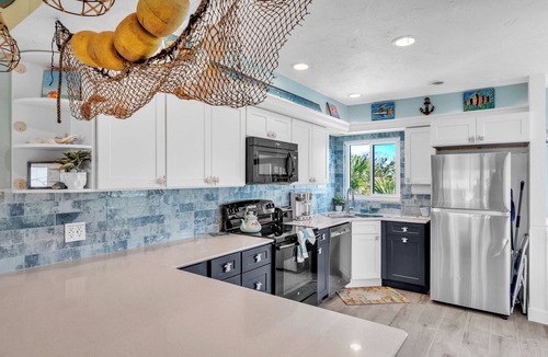 Holmes Beach Condo | Sandy Cheeks & Barefeet, Gorgeous interior Gulf beach Place, pool, on beach side