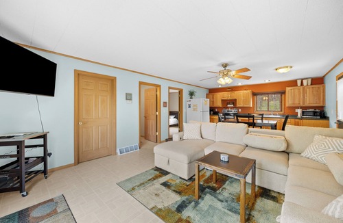 Nekoosa Cottage | Scenic riverfront cottage with boat landing and docks.