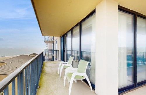 Bethany Beach House | Sea Colony 6th floor condo with balcony shared tennis court & partial ocean view