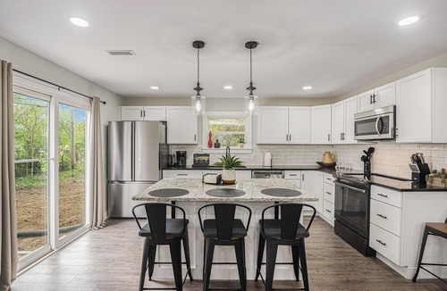 Grandview House | Secluded ½-acre retreat surrounded by trees for ultimate privacy and quiet. Remodeled and beautifully furnished with modern finishes. Enjoy a peaceful setting just 8 minutes from Belton/Raymore—perfect for relaxing stays or extended work trips.