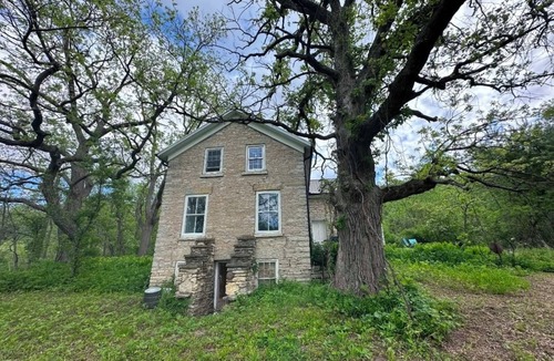 Decorah House | Secluded 1860 Stone House recently remodeled on the Upper Iowa River by Bluffton
