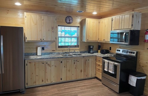 Lejunior Cabin | Secluded Cabin with a mountain view, hot tub, full kitchen, and living room.