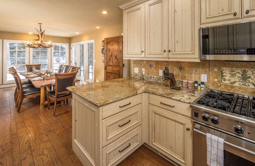 Big Sky Meadow Village House | Secluded home close to Meadow Village w/private hot tub & library | Creekside Retreat