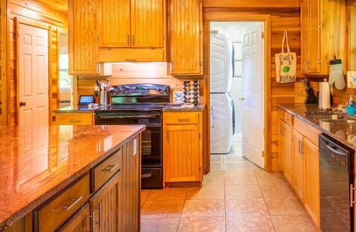 Hot Springs Cabin | Secluded Luxury Cabin with Private Waterfall, Mountain Views, Game Room, and Scenic Hiking Trails