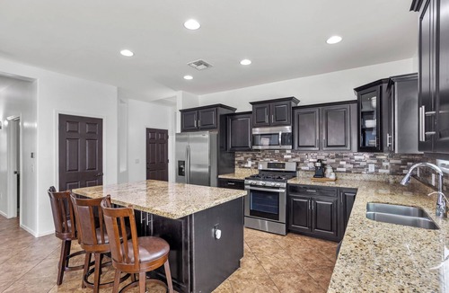 Corona de Tucson House | Secluded vibes, fireside stargazing, sparkling pool, and modern comfort.