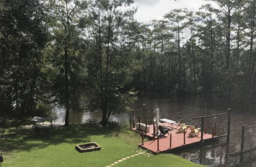 Freeport House | Secluded Waterfront with deep water dock, trailer parking, and public boat ramp
