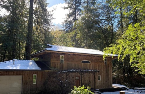 Coos Bay House | Serene Creekfront Lodge style home hidden away in Elliot National Forest