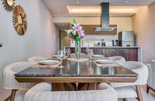 Flamingos Condo | Serene Garden-View retreat at Peninsula