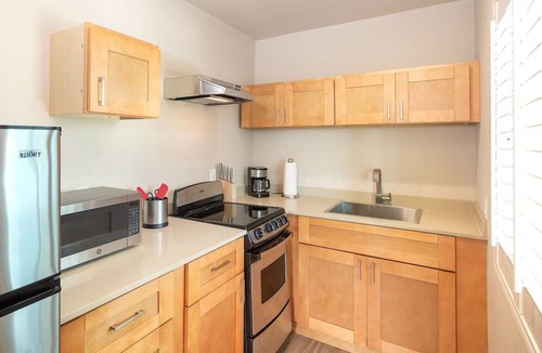 Layton Hotel | Serene Island Studio | Balcony, Pool & Kitchen