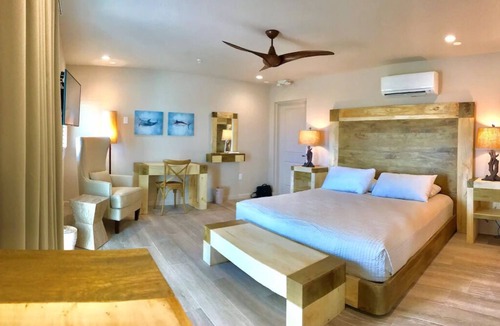Layton Hotel | Serene Island Studio | Balcony, Pool & Kitchen
