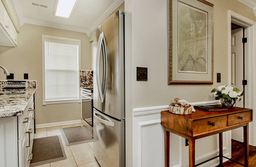 Waterford Plantation Condo | Serene lakefront condo with pool full kitchen, pond and golf course view, & W/D