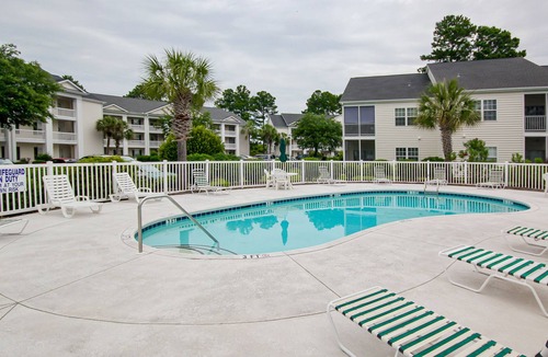 Waterford Plantation Condo | Serene lakefront condo with pool full kitchen, pond and golf course view, & W/D
