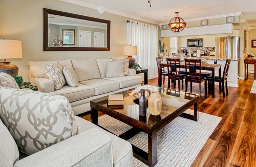 Waterford Plantation Condo | Serene lakefront condo with pool full kitchen, pond and golf course view, & W/D