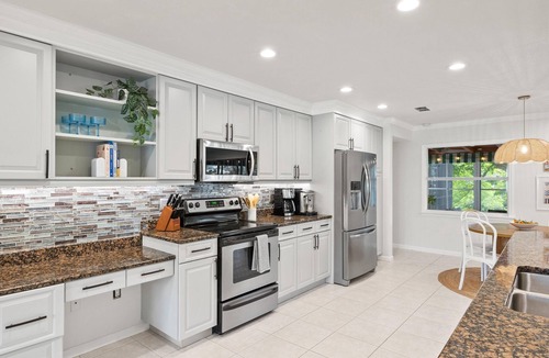 Palma Sola House | Serene Lakefront Retreat | Private Dock and Pool!