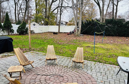 Coram Apartment | Serenity Haven: Cozy 2-Bedroom Home with Spacious Living & Big Backyard