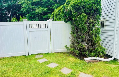 Coram Apartment | Serenity Haven: Cozy 2-Bedroom Home with Spacious Living & Big Backyard