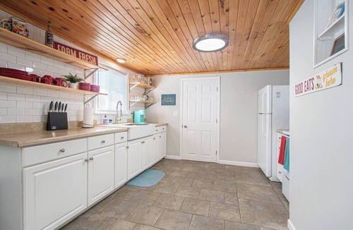 Paw Paw Lake House | Short Description: Lakewood Bungalow | Screened Porch 2 Baths Basement Hangout Walk to Lake Onsite Laundry