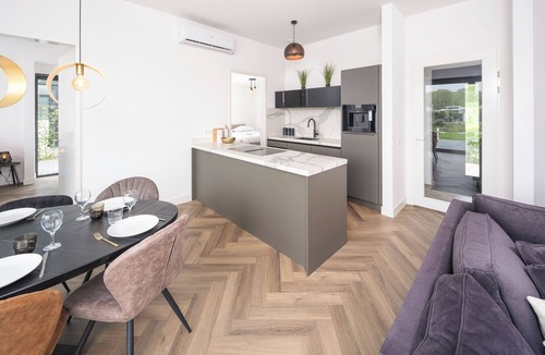 Biddinghuizen House | Single-storey 8-person villa with private inflatable boat, luxury built-in bean-to-cup coffee machine, Quooker and swim deck.