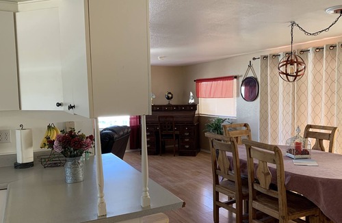 Bullhead City Cottage | Sits across the street from waterfront and up on a hillside with river view.