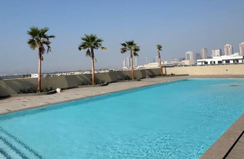 Jumeirah Village Triangle Apartment | Skyline Views: Sunset One Bedroom with Balcony