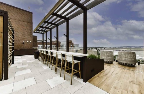 Crystal City Apartment | Sleek 2BR Residence with Gym, Parking & Rooftop Deck