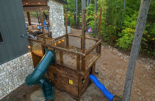 Pickens Cabin | Sleeps 18 people with a private heated pool, hot tub, playground, fire pit, and a private arcade!
