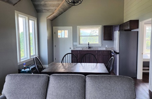 Brooks House | Small cottage house, centered on 100 acres surround by hills, lake, and cattle.