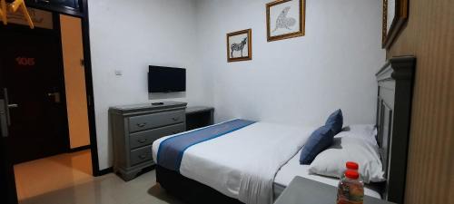 Dinoyo Hotel | Smart Tlogomas Syariah