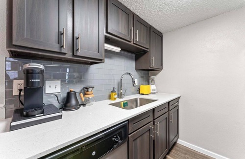 Dawson Apartment | SoCo 2BR corner suite, king bed, fast WiFi w/pool