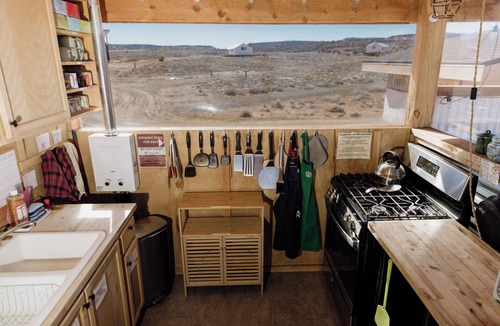 Monticello RV Rental | Solar Powered Casita with 2 beds and a comfy seating area overlooking a peaceful desert setting