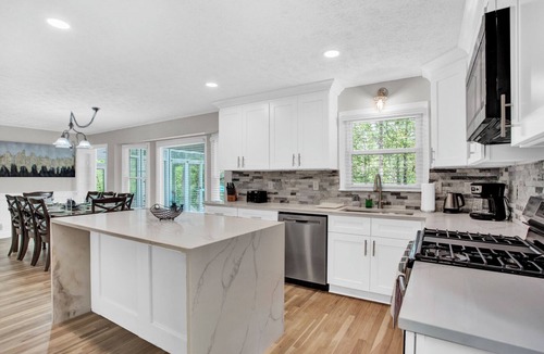 Lilburn House | Spacious 3-level Fun House Pool HotTub Theater GameRoom BBQ