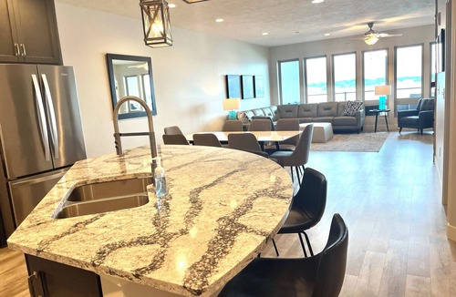 Arnolds Park Condo | Spacious 4 Bedroom Lakefront Luxury. Panoramic Views & 6 waterpark passes at BB.