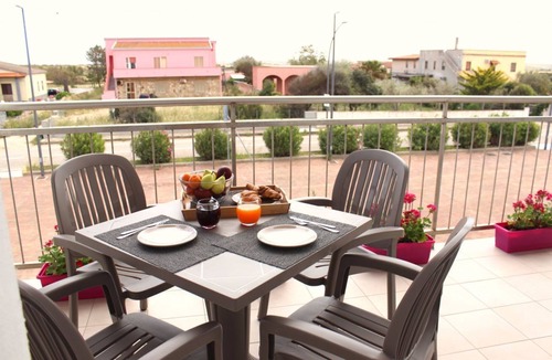 Stintino Apartment | Spacious 40 square meter apartment with independent access via magnetic card. The accommodation includes a fully equipped kitchenette, a living room with a comfortable sofa bed for two, a bedroom with a double bed, and a private bathroom with a shower an