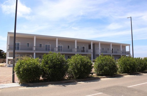 Stintino Apartment | Spacious 40 square meter apartment with independent access via magnetic card. The accommodation includes a fully equipped kitchenette, a living room with a comfortable sofa bed for two, a bedroom with a double bed, and a private bathroom with a shower an