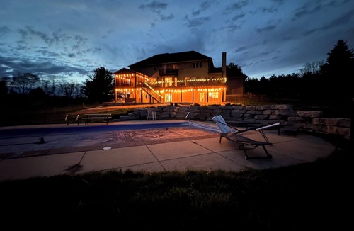 Dane County House | Spacious 5-bedroom house sleeps 14 with pool, hot tub, sauna and more!