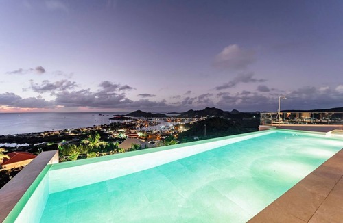 Jolly Harbour House | Spacious 6 bedroom hillside villa w/infinity pool, gym, and stunning views.