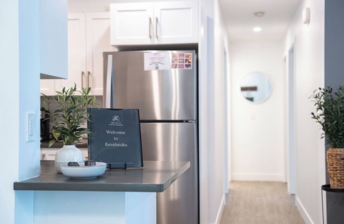 Revelstoke Condo | Spacious and comfortable modern mountain getaway, large patio with BBQ, pet-friendly and plenty of storage for bikes and skis.
