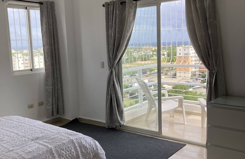 La Romana Apartment | Spacious and relaxing with an amazing town skyline and far island & ocean view.