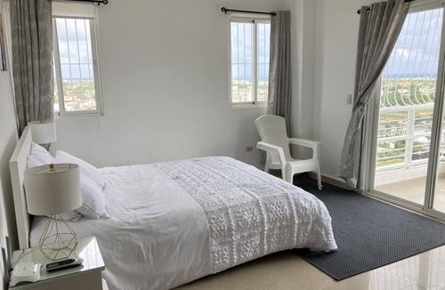 La Romana Apartment | Spacious and relaxing with an amazing town skyline and far island & ocean view.